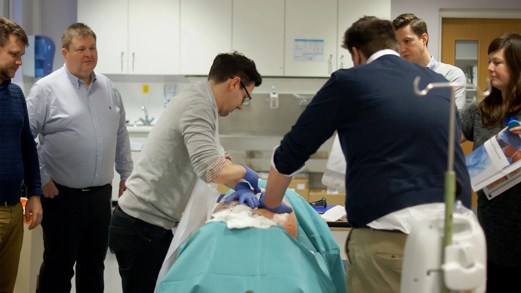 Surgical simulation lab with observers watching procedure
